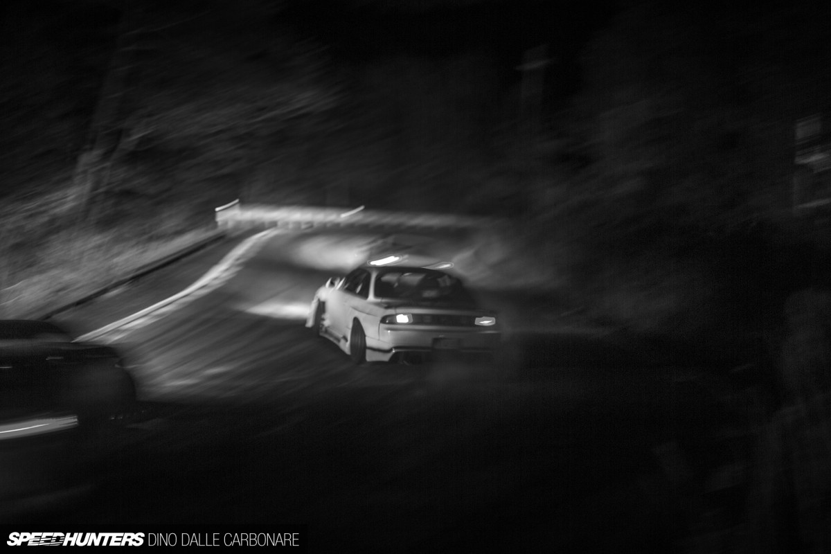 A jdm car drifting at night in the mountain